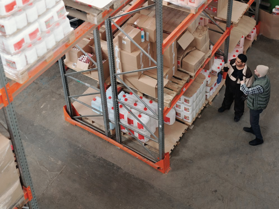shelves filled with cardboards packages and goods