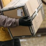 a delivery person carrying a package