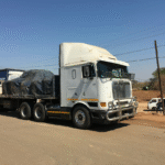 very big white truck with some goods on it